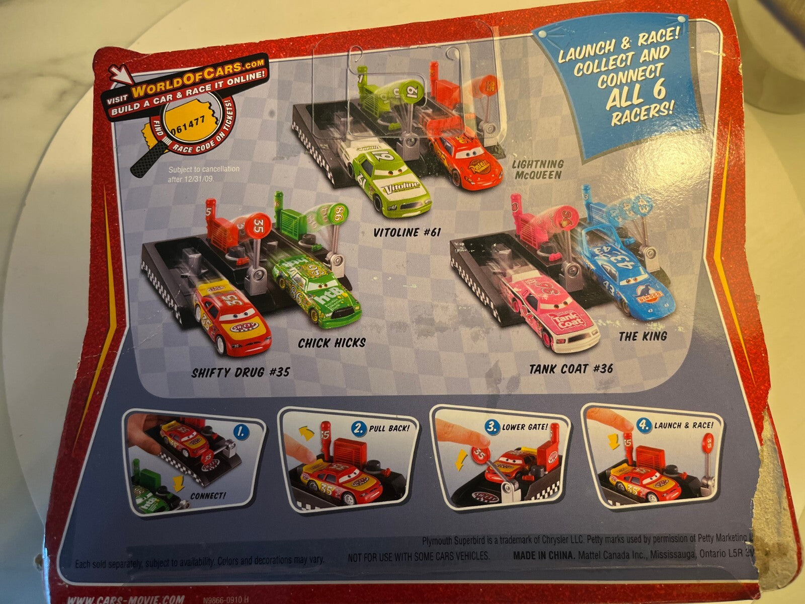 Voiture Cars Disney Kevin Racingtire + lanceur blister abimé mais voiture neuve