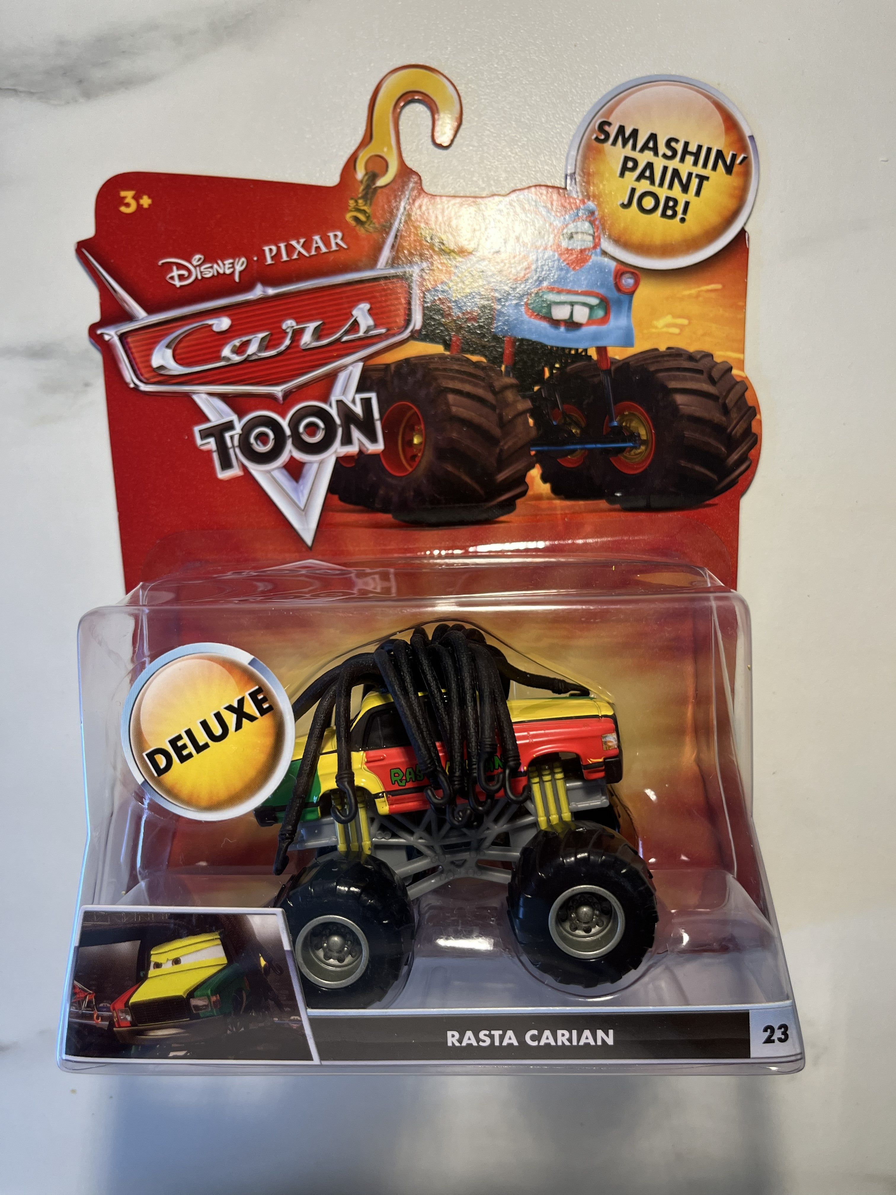 Rasta Carian #23 – Cars Toon Monster Truck Mater – Disney Pixar Cars Deluxe – Neuf sous blister