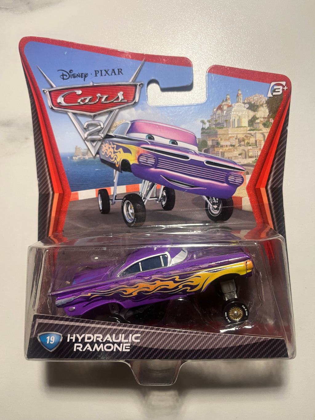 Hydraulic Ramone #19 – Disney Pixar Cars 2 – Mattel – Lowrider – Neuf sous blister