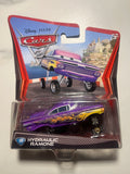 Hydraulic Ramone #19 – Disney Pixar Cars 2 – Mattel – Lowrider – Neuf sous blister